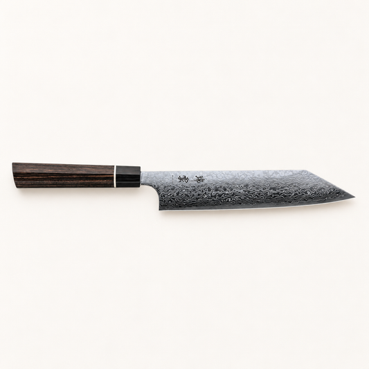 Kanetsugu Zuiun Kiritsuke – hele kniven på varm, lys bakgrunn